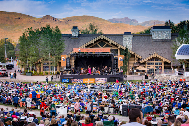 Guests enjoy an outdoor concert at River Run in the summer