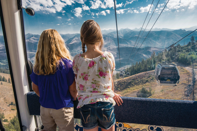 Kids look out at the mountains surrounding Sun Valley from the Gondola